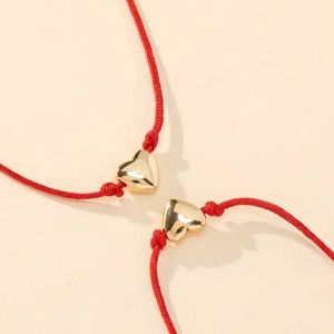 Red string heart bracelet